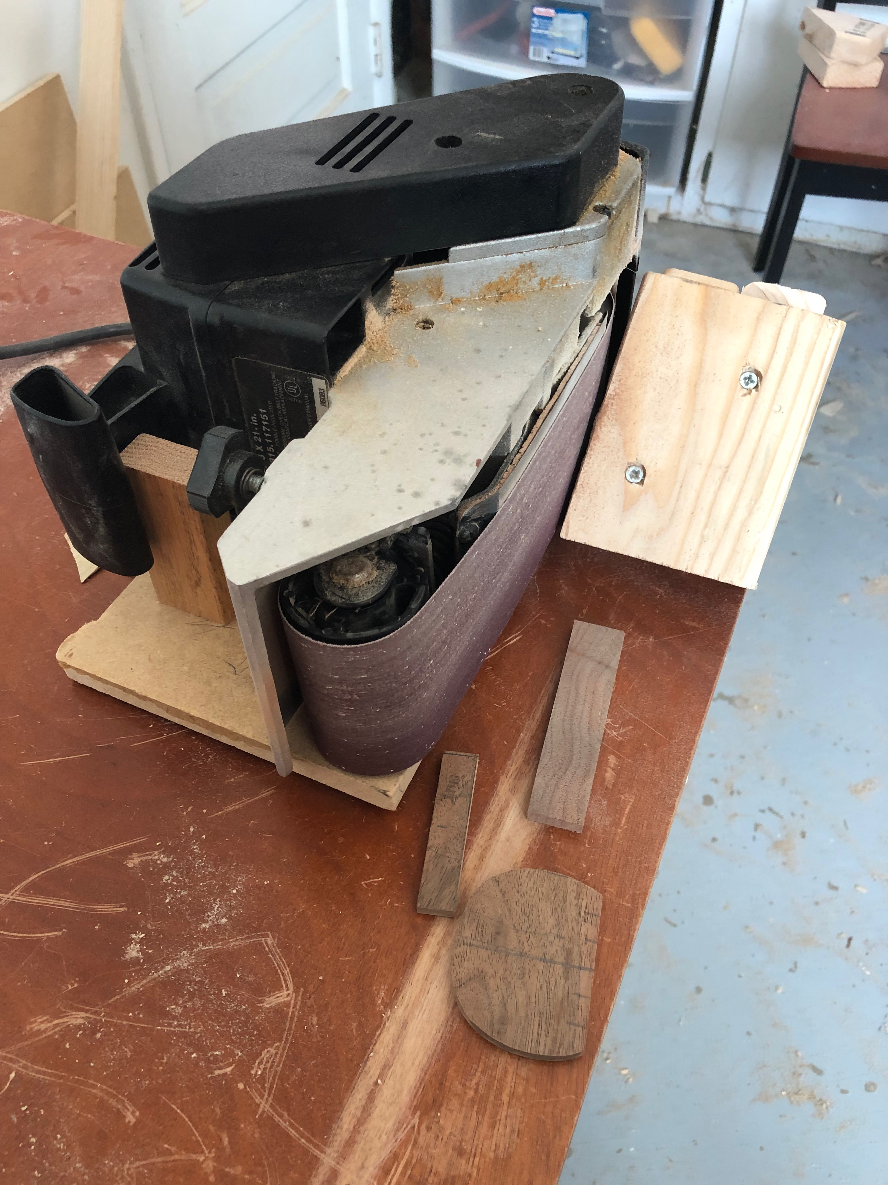 A rigged up belt sander