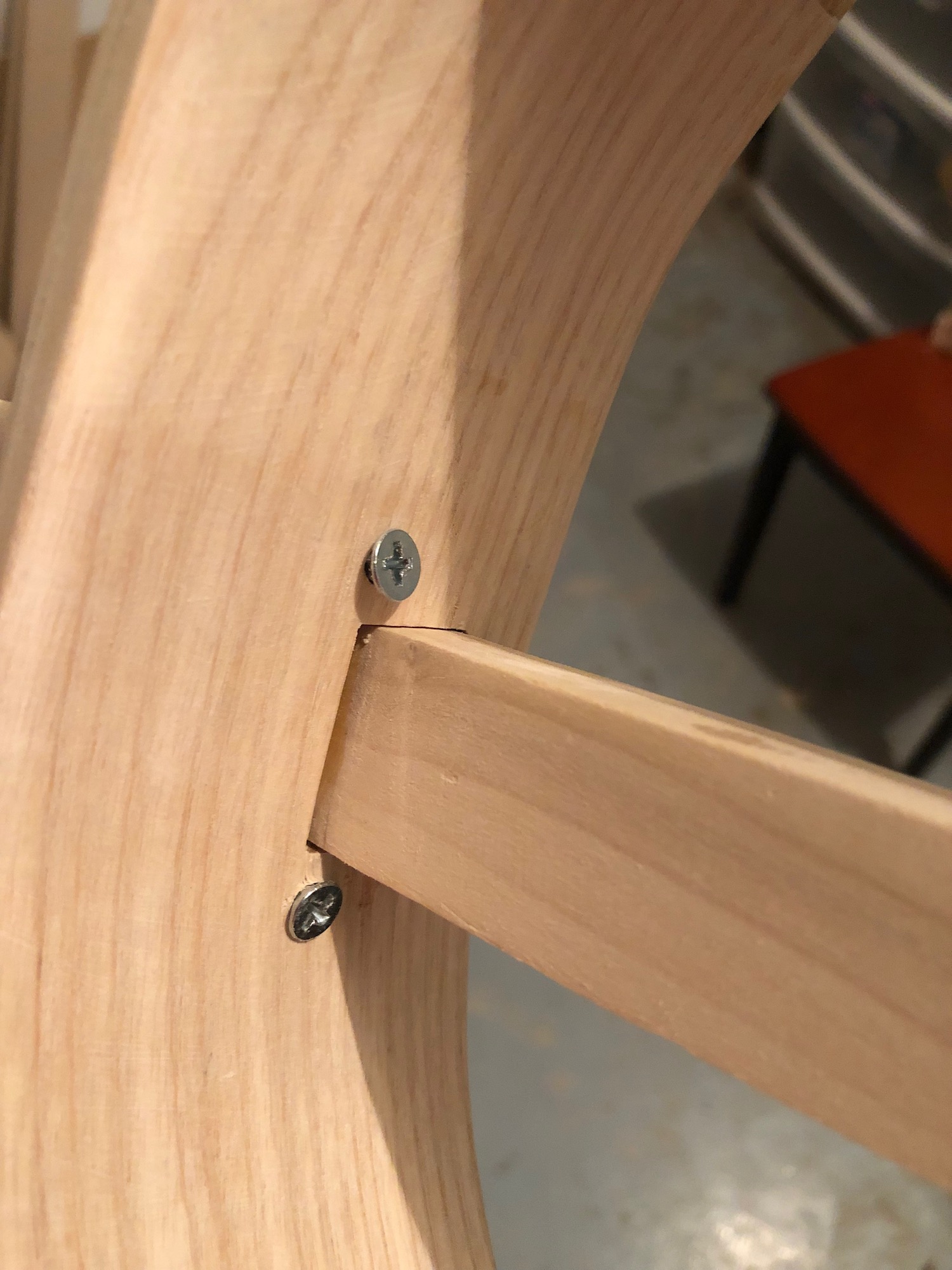 Using screws to attach the neck to the rim